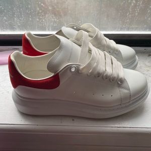 Red and white Alexander mcqueens size 7 in men